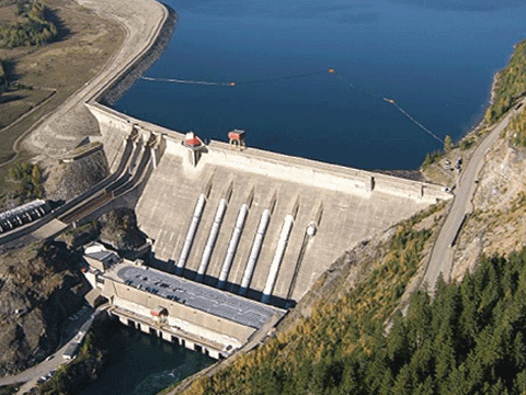 View from above of the Revelstoke dam, with the lake behind it,