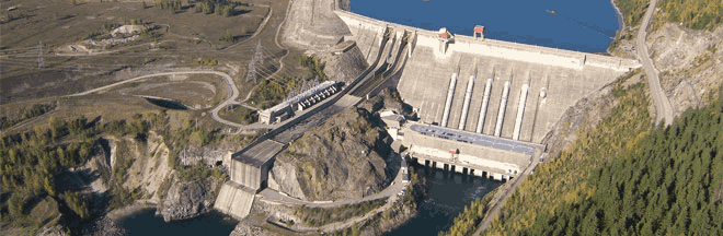 Photo from the air of the Revelstoke dam and the lake behind it. The dam has 6 pies, five of which are completed and the last of which is the focus of this BC Hydro capital project.